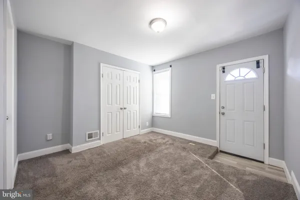 a view of an empty room and window