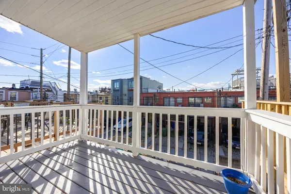 a view of a balcony with wooden floor