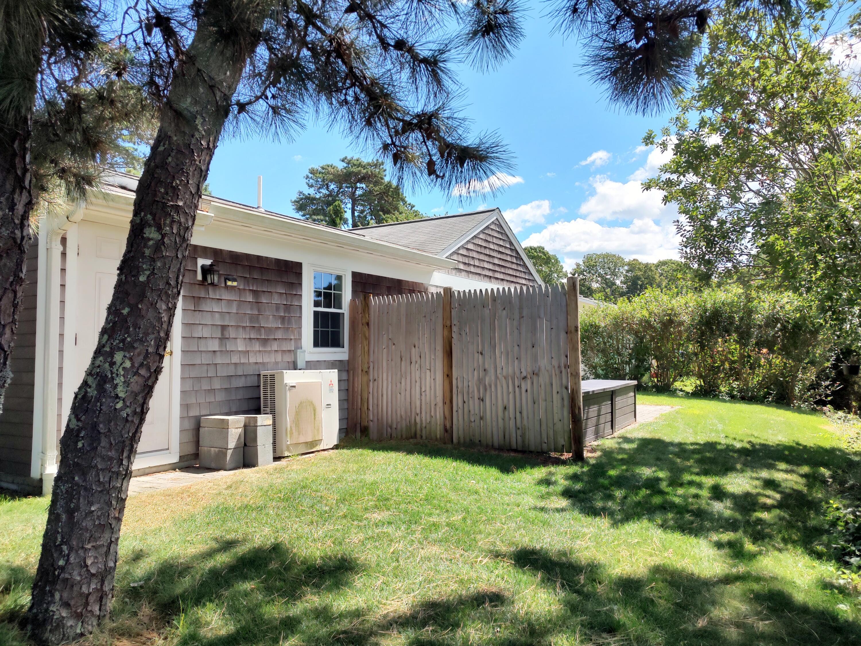 25 Mary-David Road, Unit 50A Yarmouth Port, MA 02675 - Photo 16 of 59 a front view of a house with garden