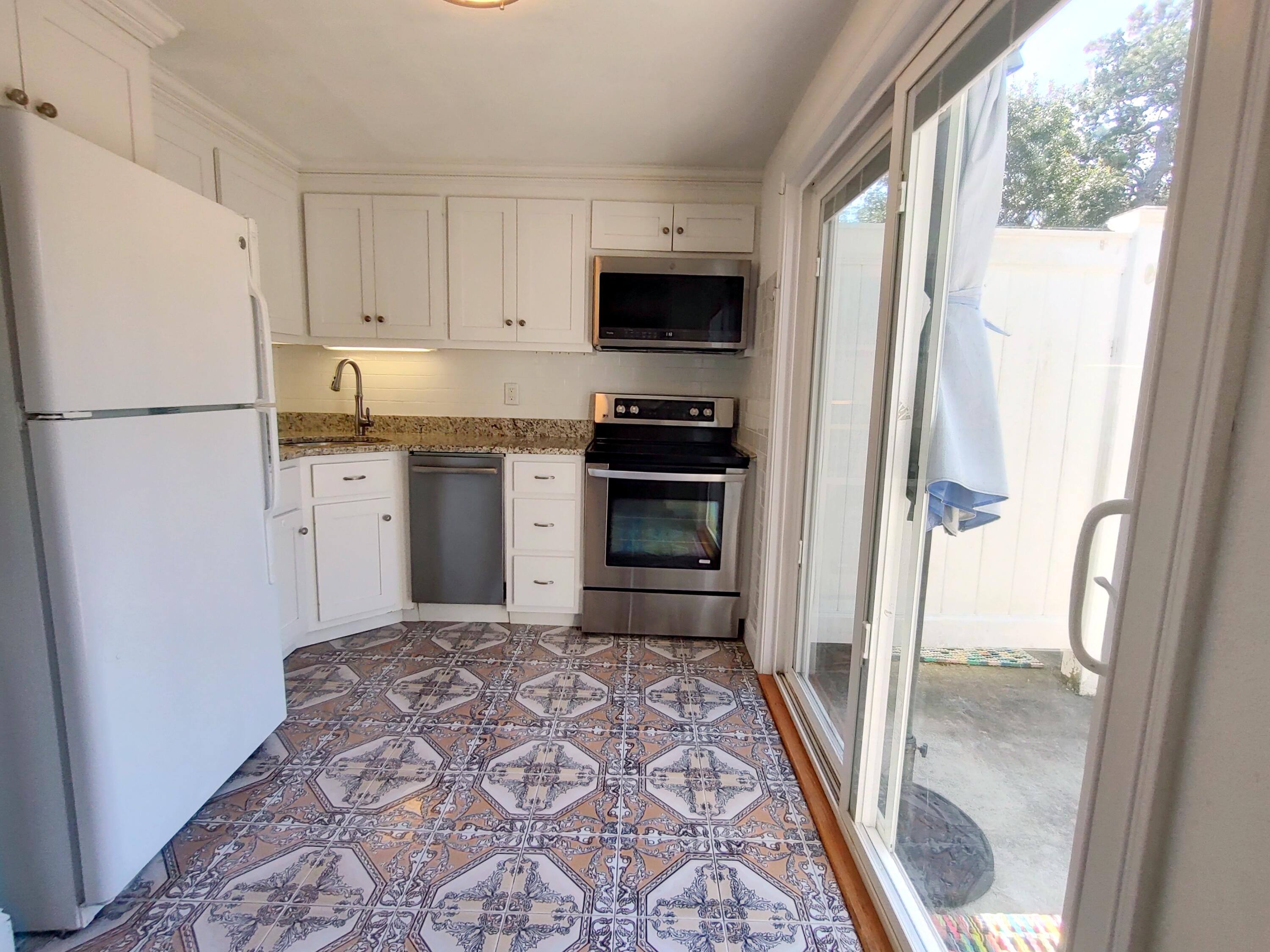 25 Mary-David Road, Unit 50A Yarmouth Port, MA 02675 - Photo 19 of 59 a kitchen with granite countertop a refrigerator and a sink