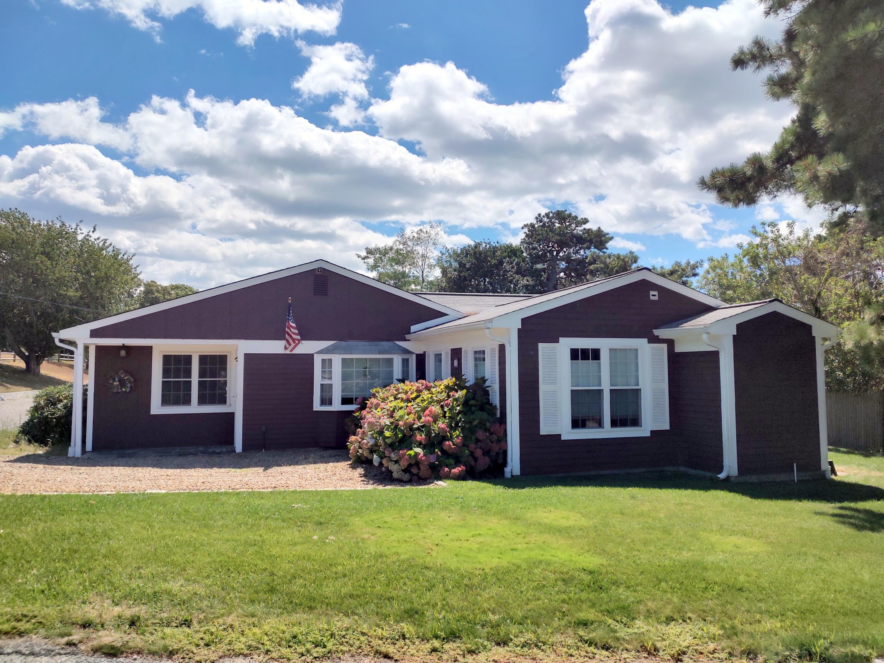 25 Mary-David Road, Unit 50A Yarmouth Port, MA 02675 - Photo 2 of 59 a front view of a house with garden