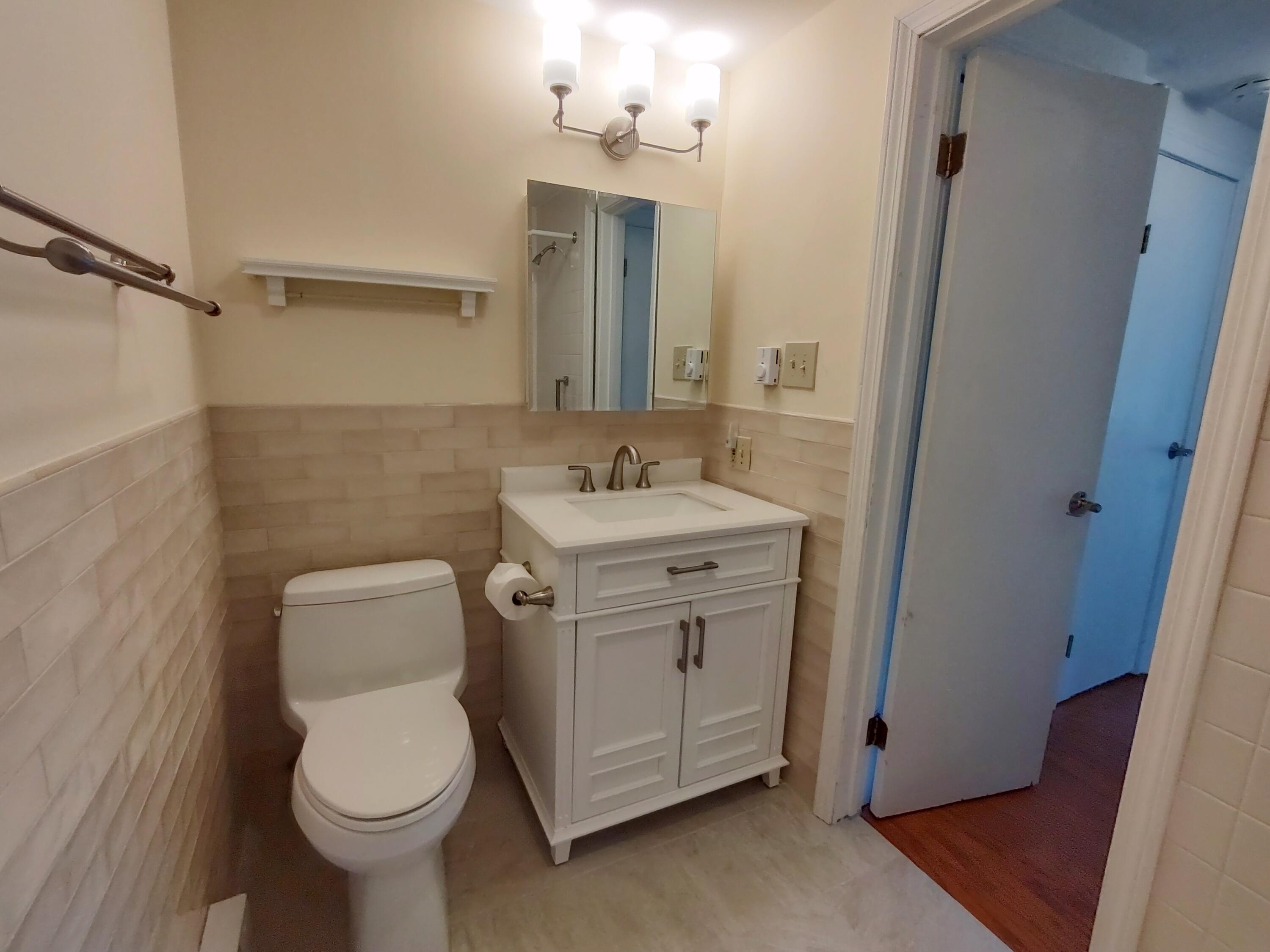 25 Mary-David Road, Unit 50A Yarmouth Port, MA 02675 - Photo 22 of 59 a bathroom with a sink toilet and mirror