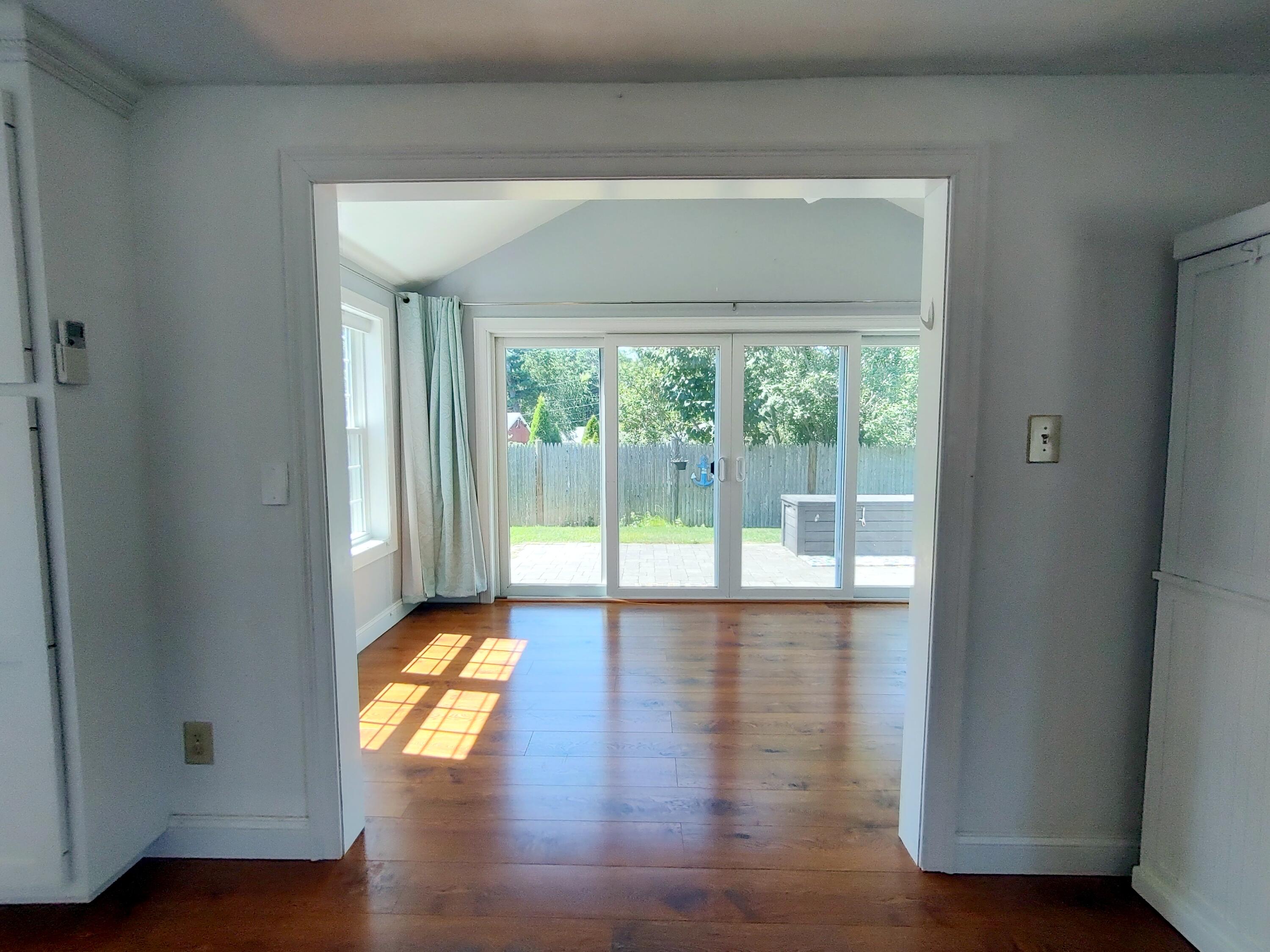 25 Mary-David Road, Unit 50A Yarmouth Port, MA 02675 - Photo 26 of 59 a view of empty room with wooden floor and fan