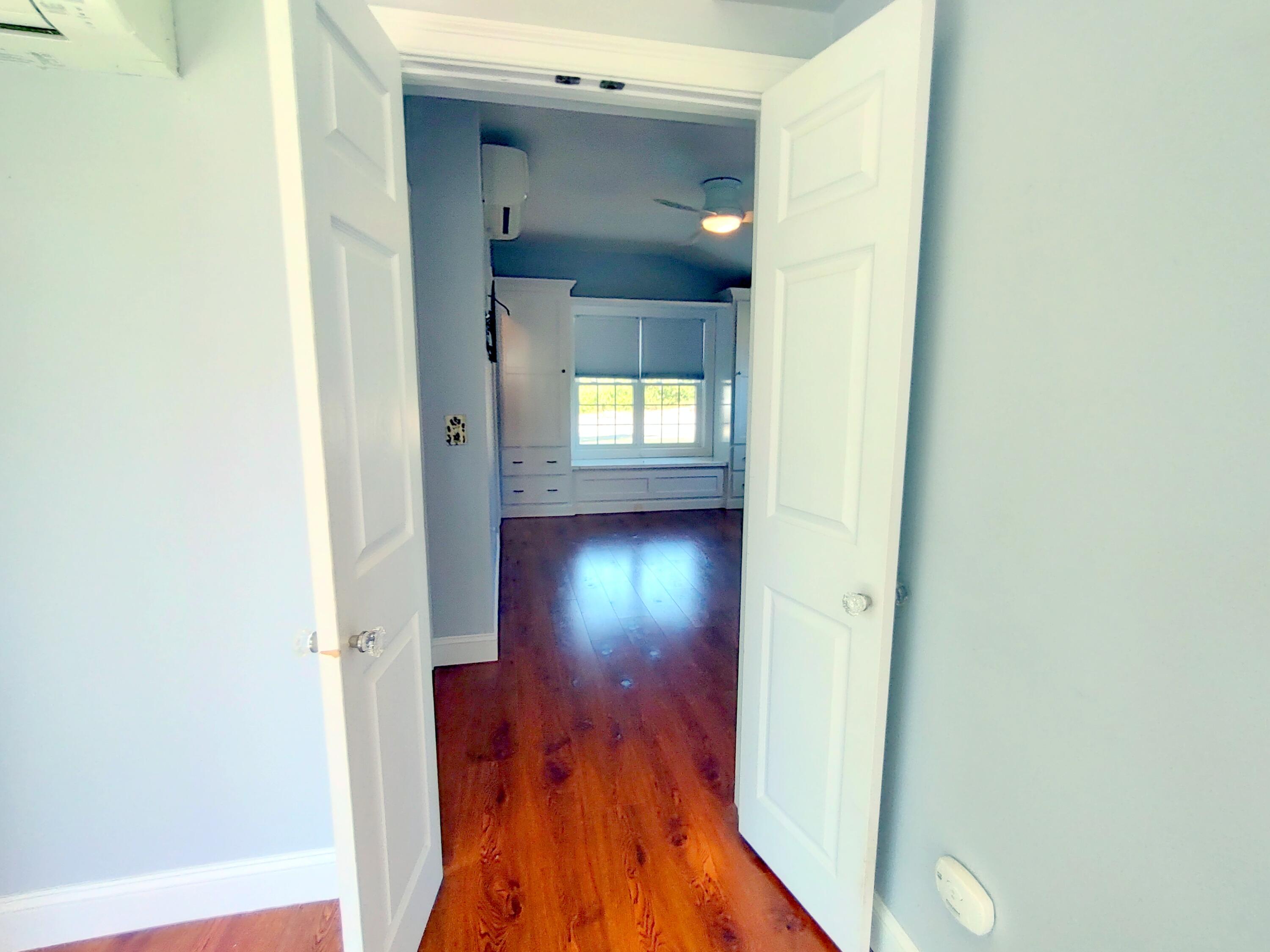 25 Mary-David Road, Unit 50A Yarmouth Port, MA 02675 - Photo 34 of 59 a view of a hallway with wooden floor and stairs
