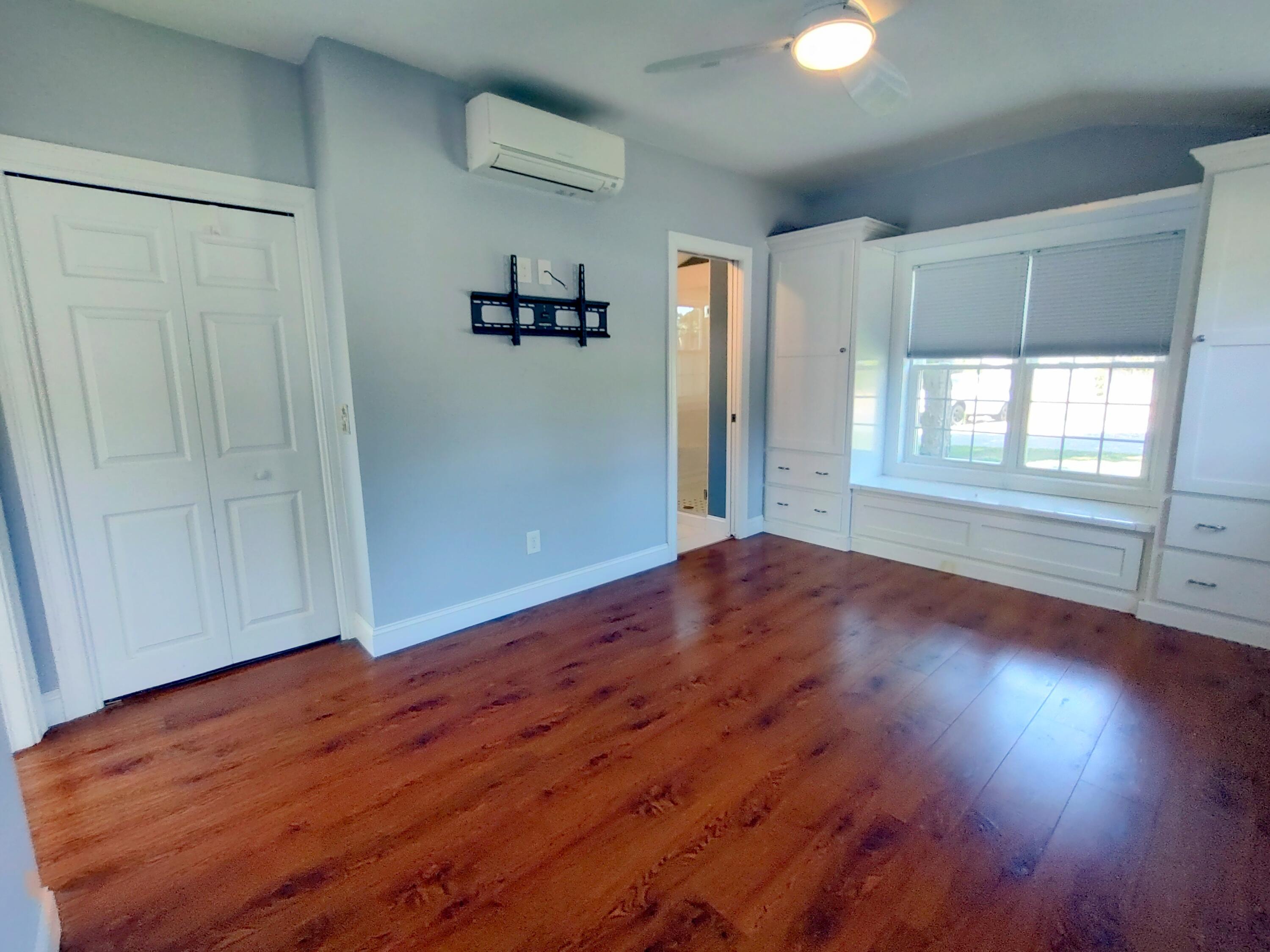 25 Mary-David Road, Unit 50A Yarmouth Port, MA 02675 - Photo 39 of 59 wooden floor in an empty room with a window