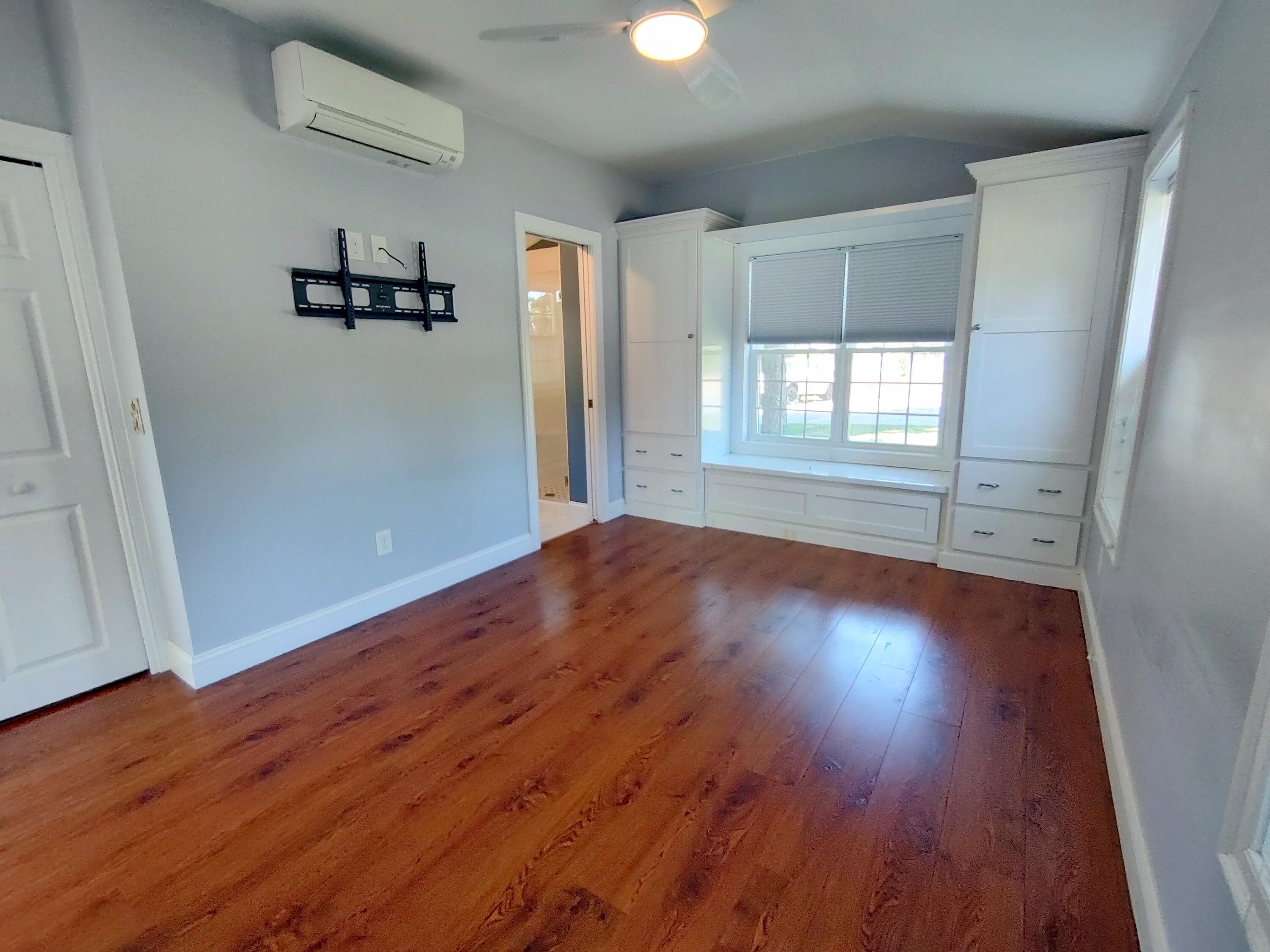 25 Mary-David Road, Unit 50A Yarmouth Port, MA 02675 - Photo 42 of 59 wooden floor in an empty room with a window