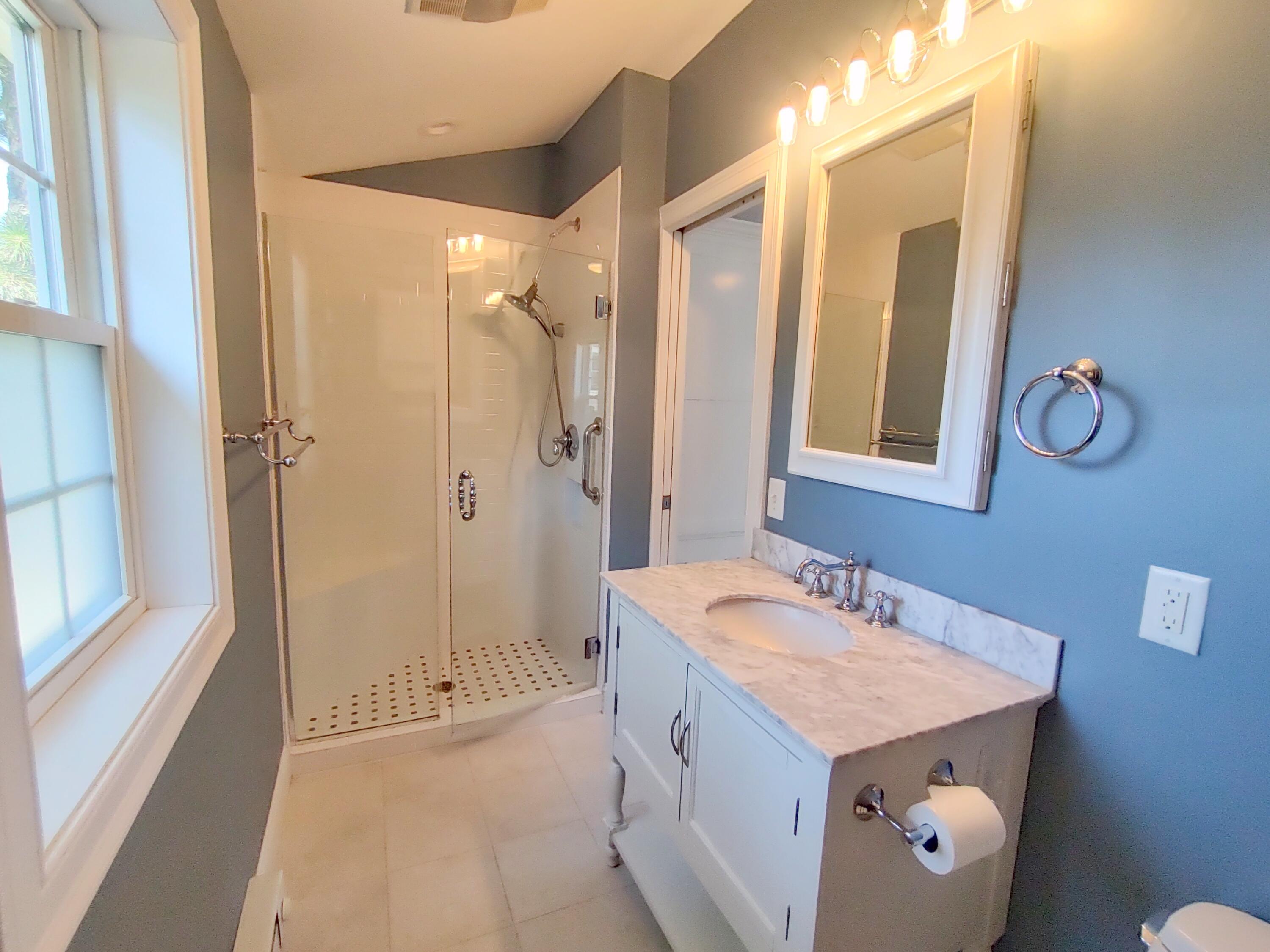 25 Mary-David Road, Unit 50A Yarmouth Port, MA 02675 - Photo 45 of 59 a bathroom with a sink a mirror and a shower