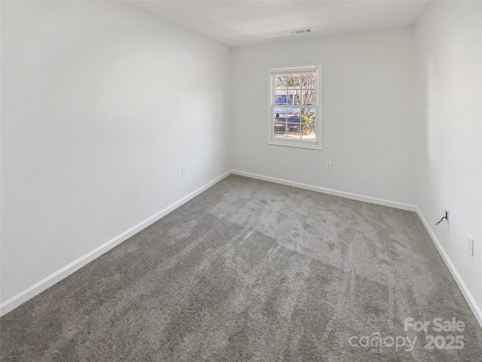 2118 Augusta Street Charlotte, NC 28216 - Photo 11 of 19 an empty room with a window