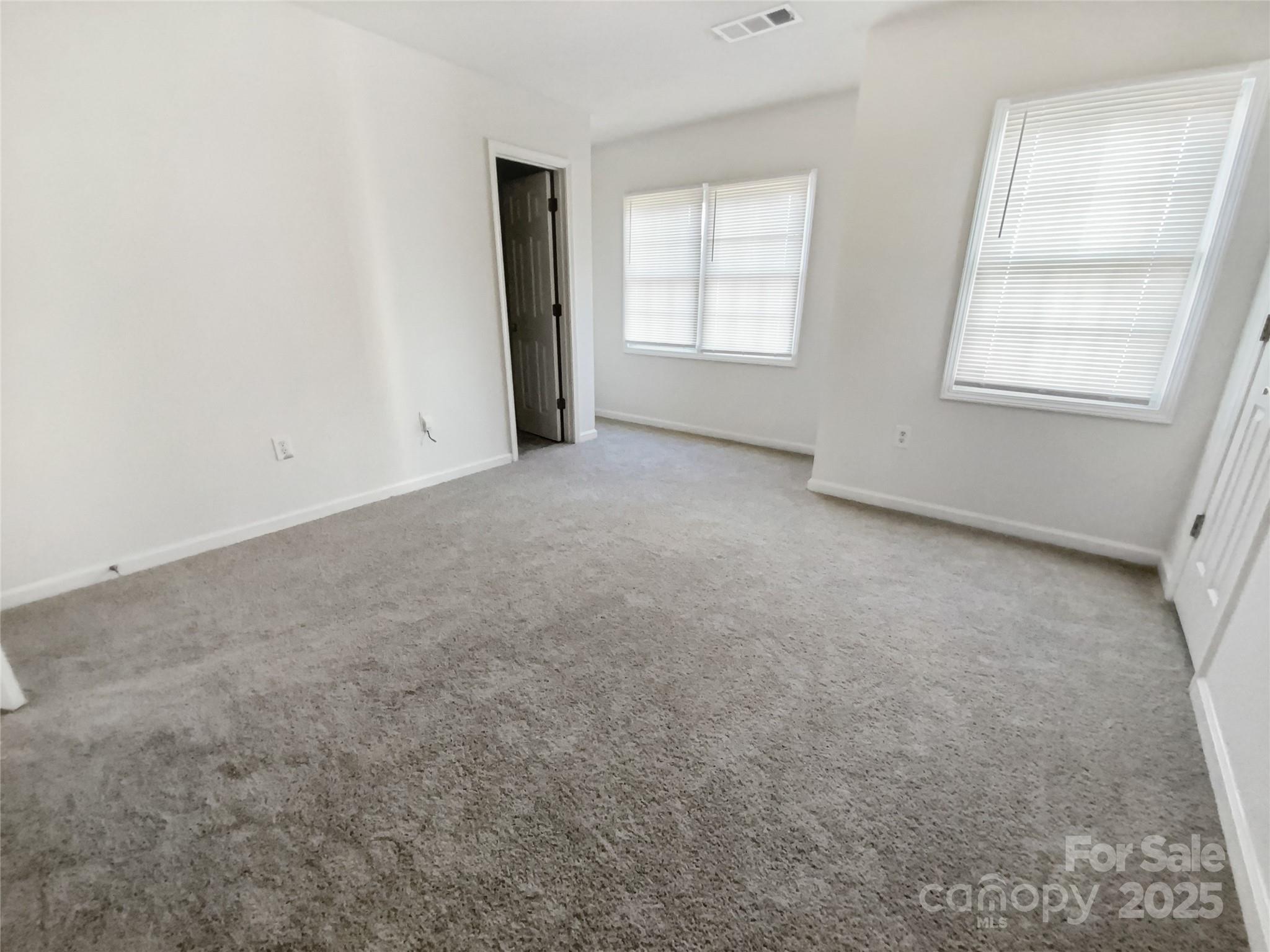 2118 Augusta Street Charlotte, NC 28216 - Photo 15 of 19 an empty room with windows