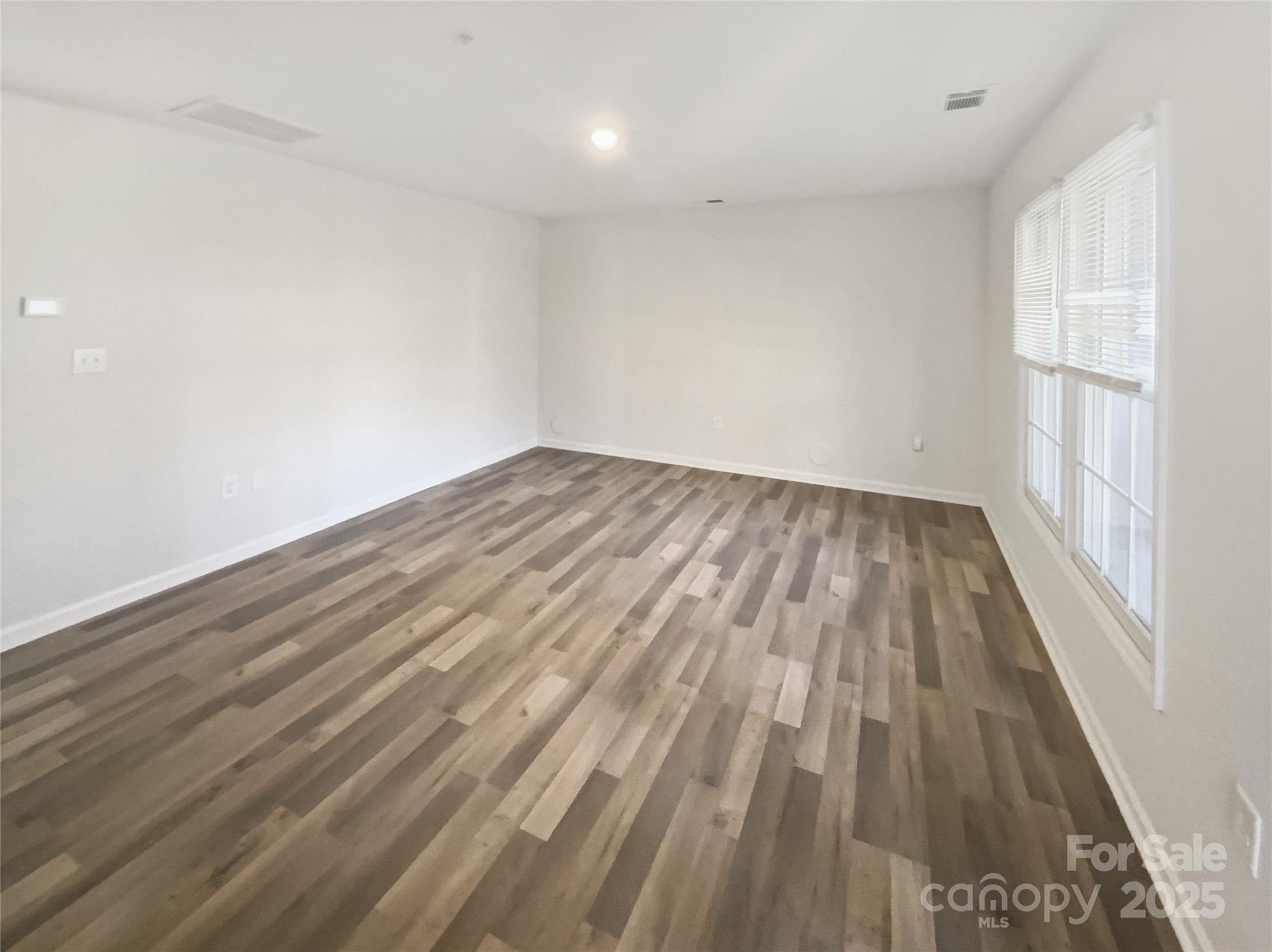 2118 Augusta Street Charlotte, NC 28216 - Photo 7 of 19 wooden floor in a hall with an entryway