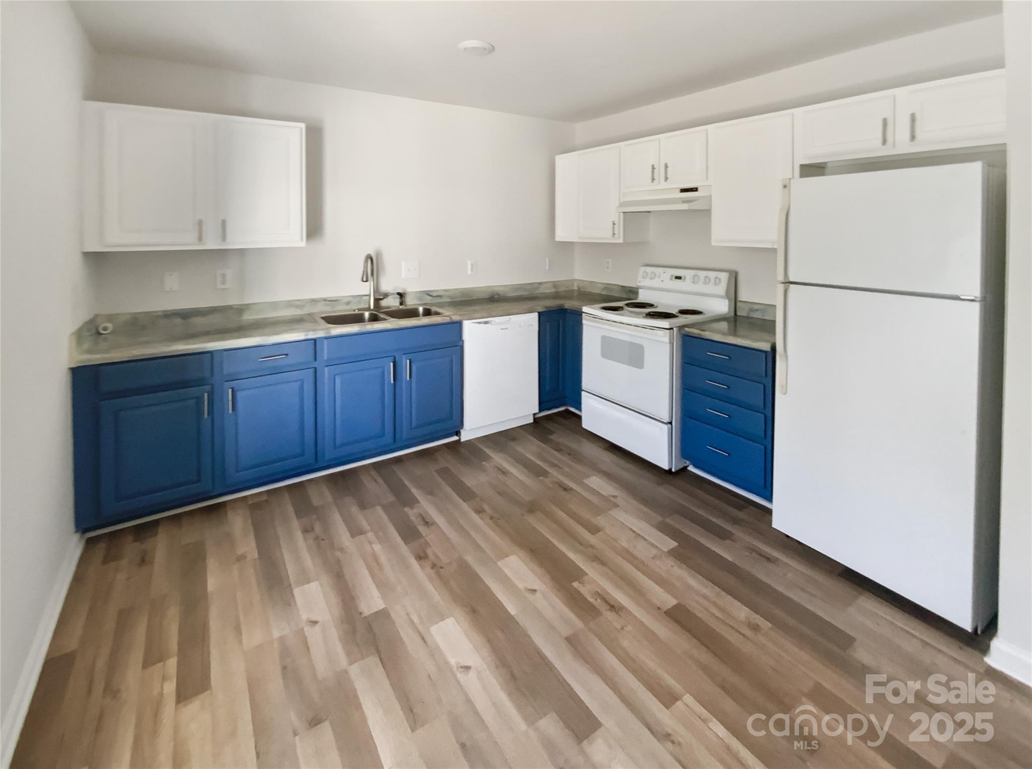 2118 Augusta Street Charlotte, NC 28216 - Photo 10 of 19 a kitchen with stainless steel appliances granite countertop a refrigerator sink and white cabinets