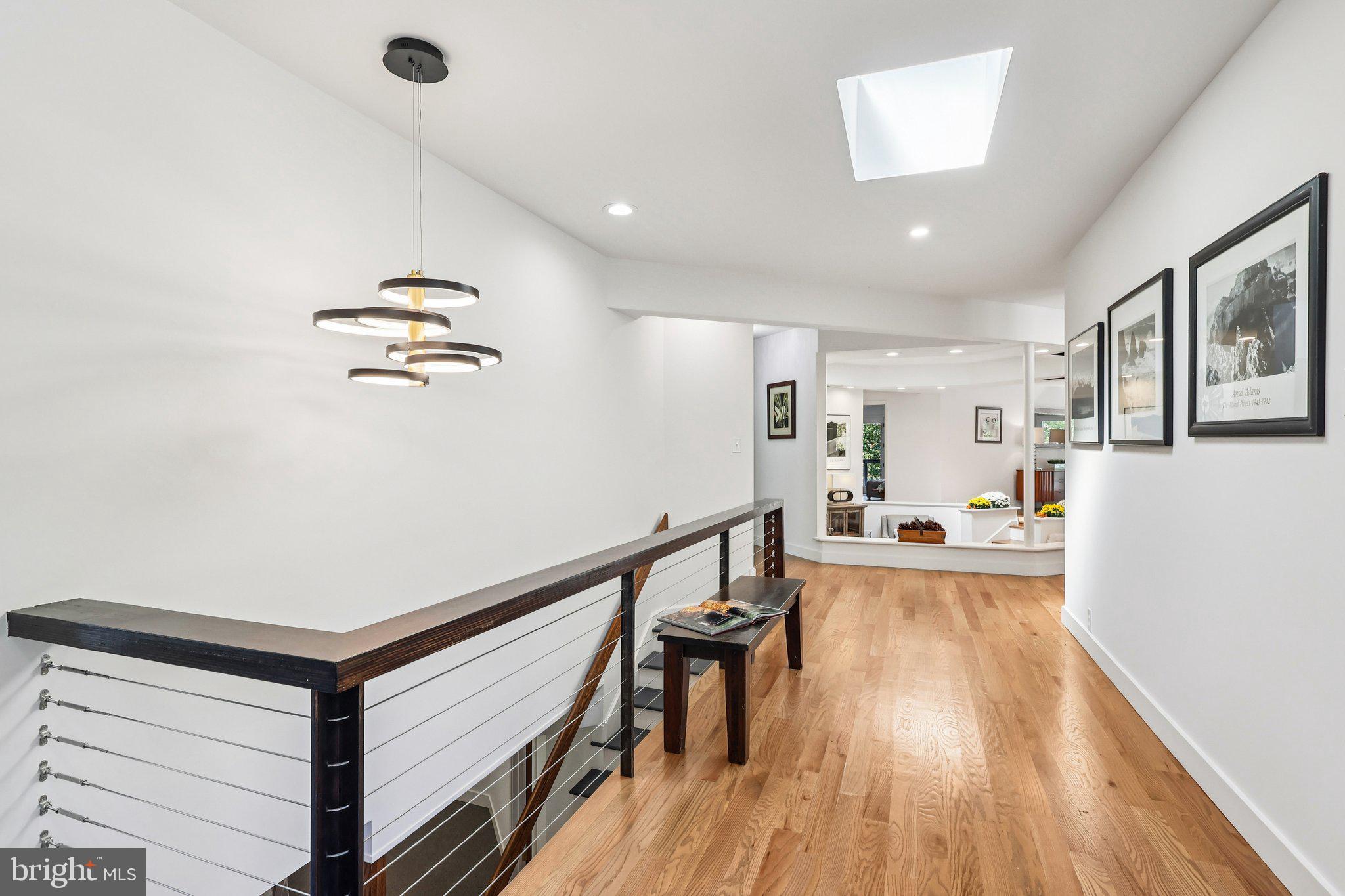855 Brandywine Road Downingtown, PA 19335 - Photo 5 of 48 a view of a hallway with wooden floor and staircase