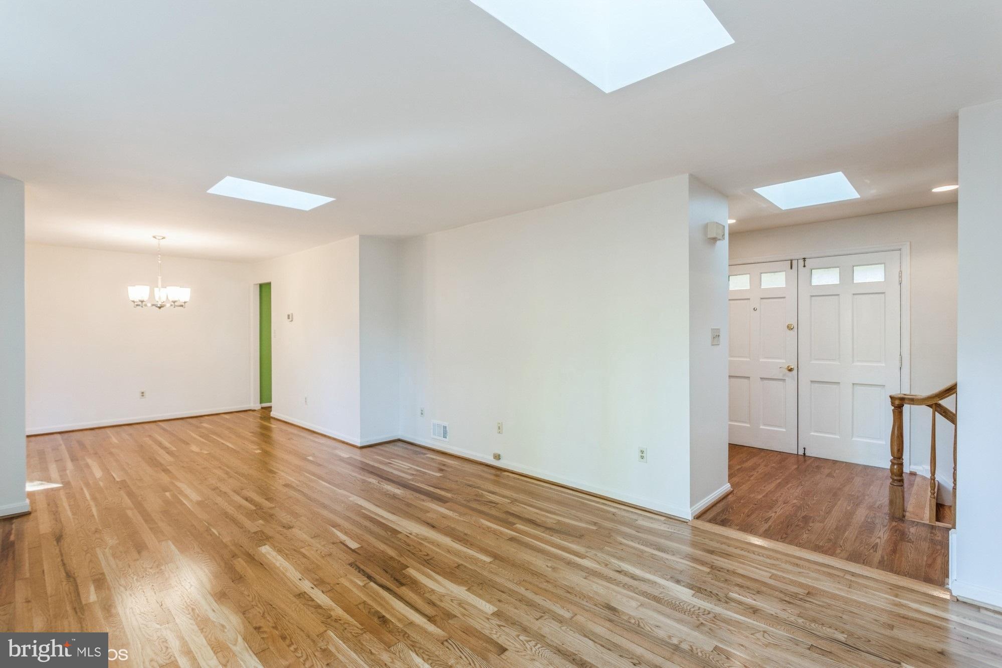 6613 Red Jacket Road Springfield, VA 22152 - Photo 5 of 40 Spacious living room with refinished hardwood