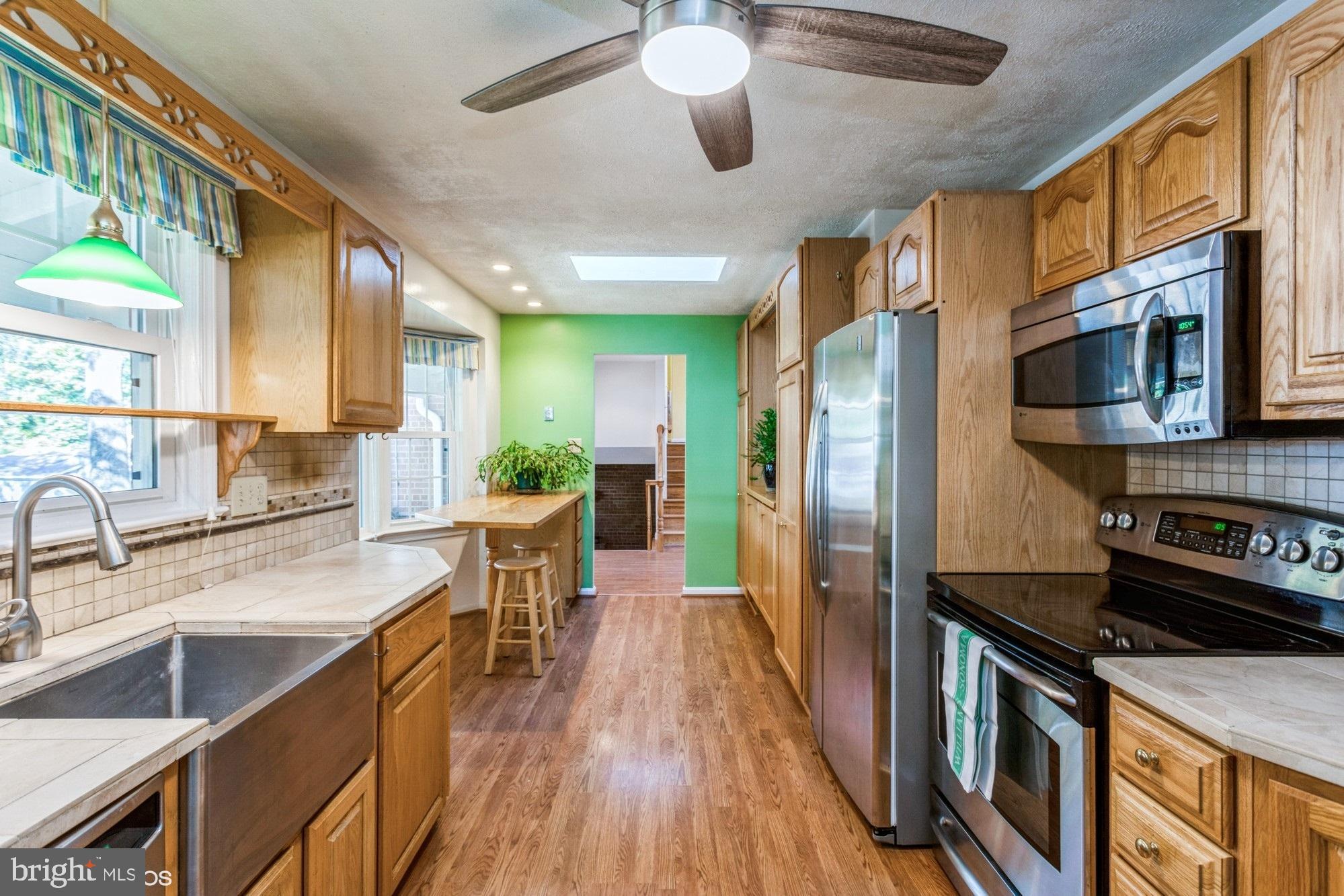 6613 Red Jacket Road Springfield, VA 22152 - Photo 9 of 40 Stainless steel appliances and deep farm sink