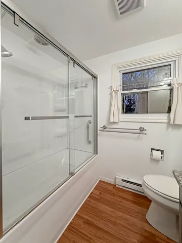 a room with furniture and wooden floor