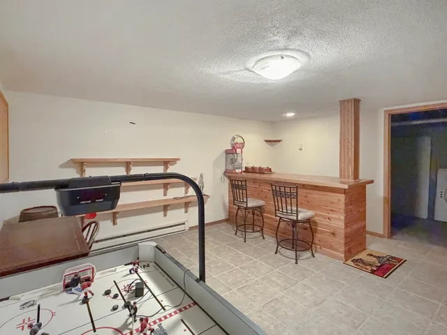 a living room filled with furniture and a flat screen tv