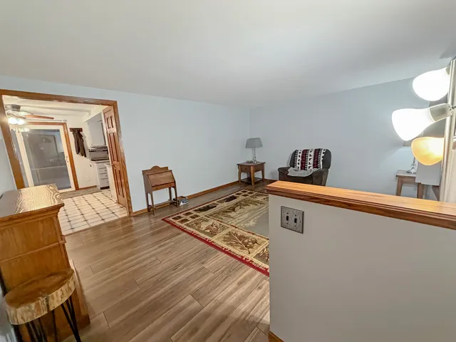 a view of a living room and wooden floor