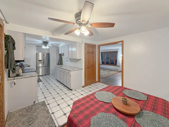 a bedroom with a bed and ceiling fan