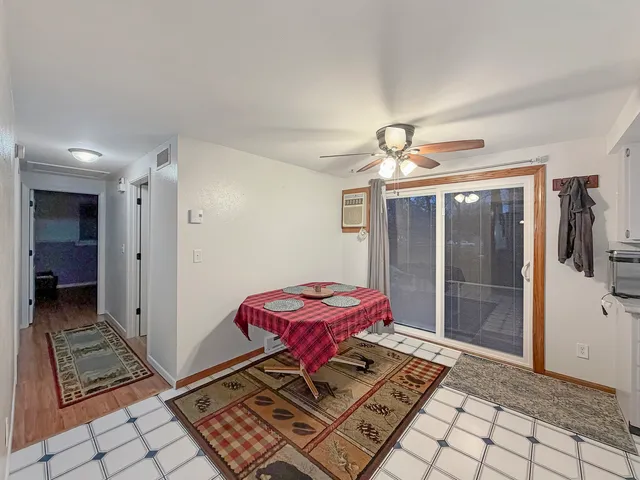 a bedroom with furniture and a flat screen tv