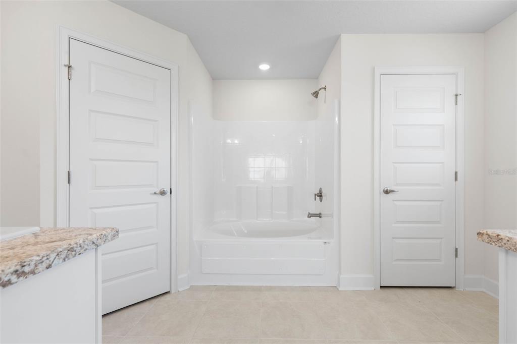 52 Undershire Path Palm Coast, FL 32164 - Photo 22 of 54 a bathroom with a bathtub