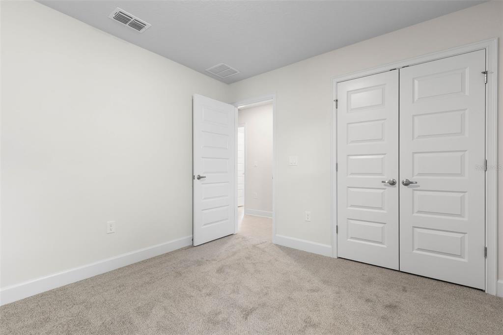 52 Undershire Path Palm Coast, FL 32164 - Photo 32 of 54 an empty room with closet area