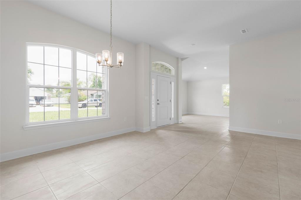 52 Undershire Path Palm Coast, FL 32164 - Photo 4 of 54 a view of an empty room with a window
