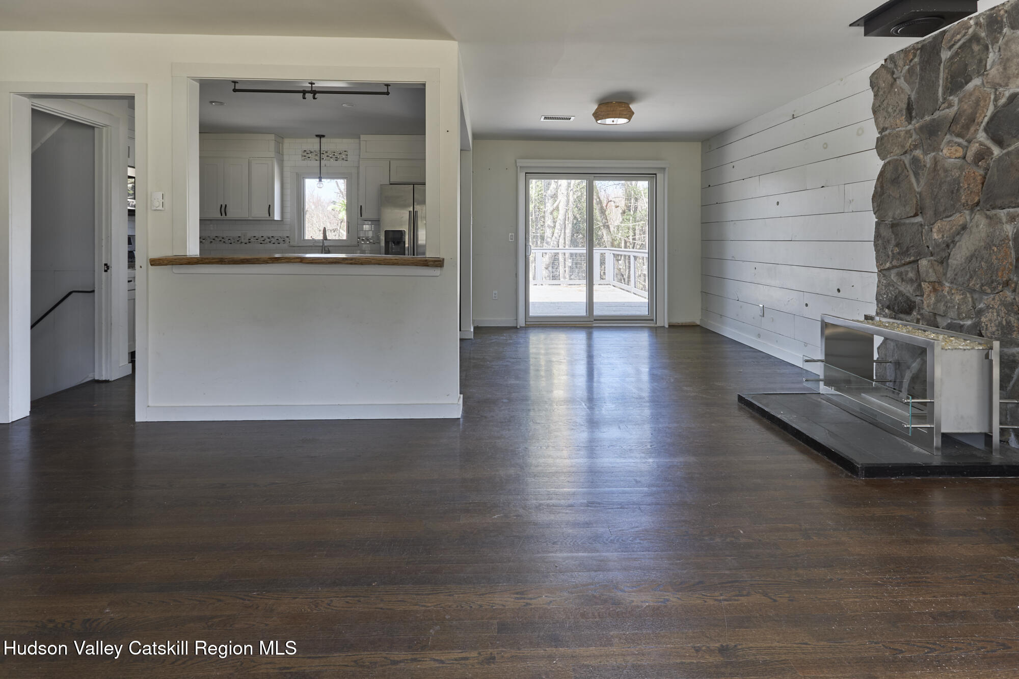361 Allen Road Salt Point, NY 12578 - Photo 8 of 28 a view of a living room and a kitchen with wooden floor