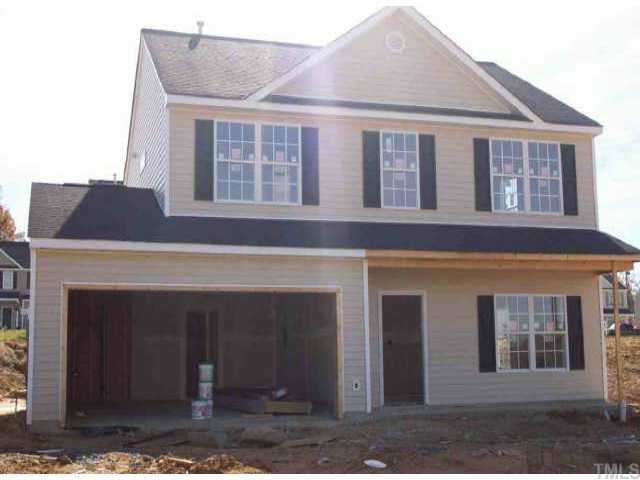 a front view of a house with a garage