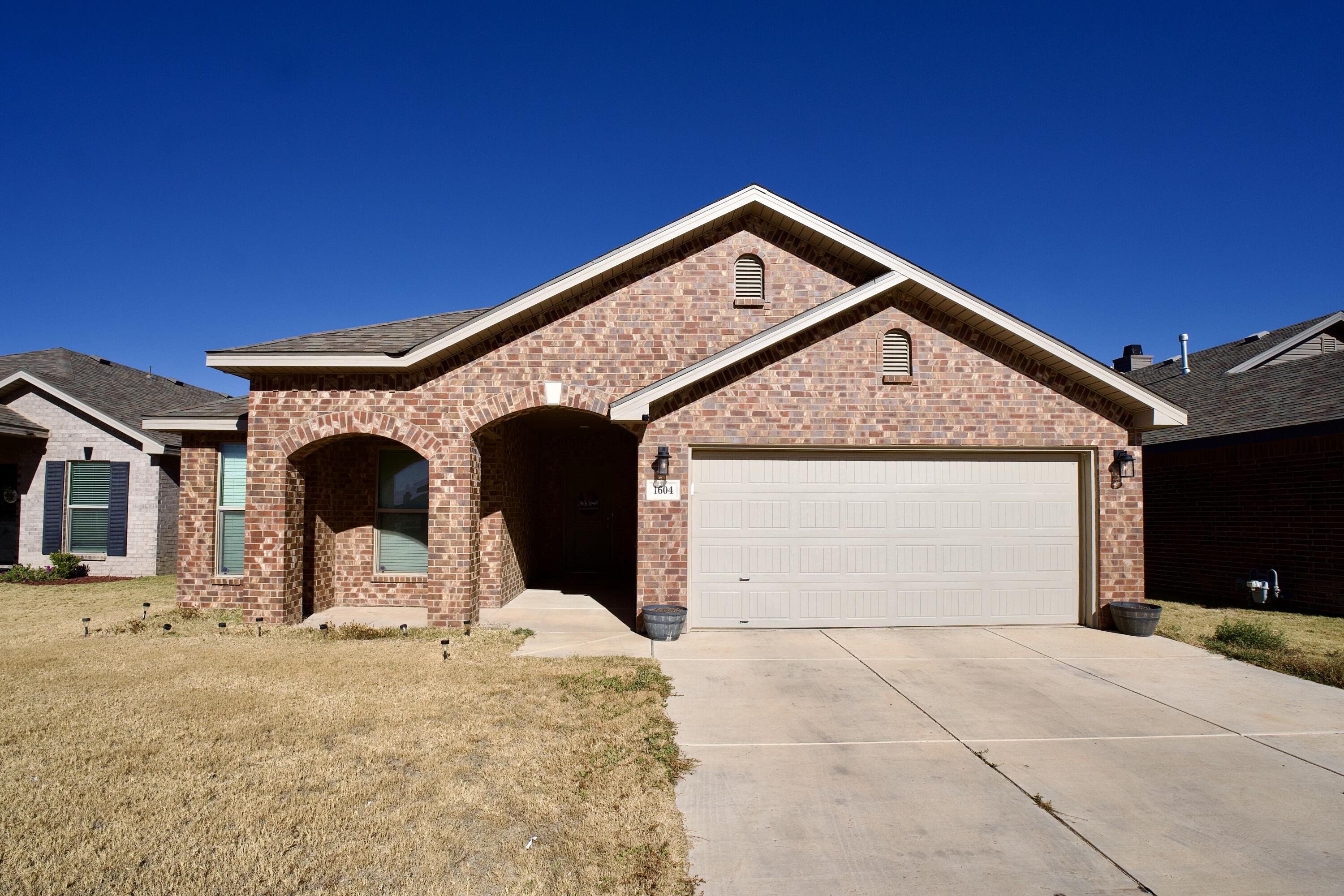 a view of house with yard