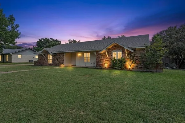 a view of a house with swimming pool and a yard