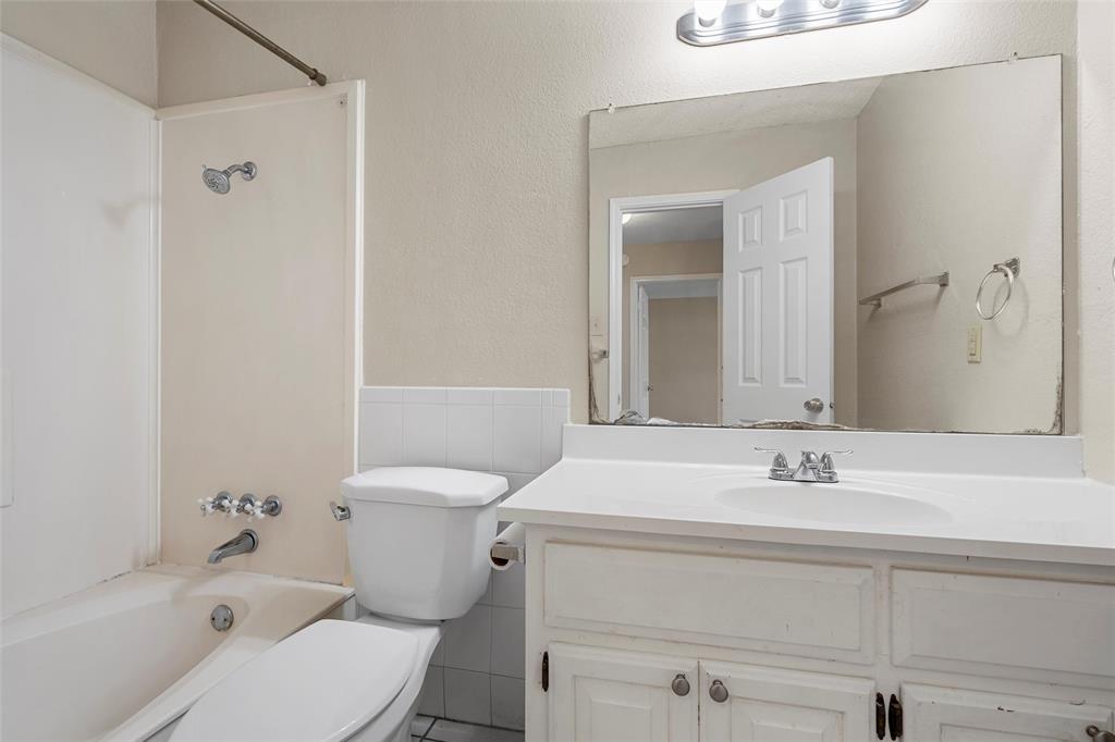 309 Crescent Drive Hewitt, TX 76643 - Photo 11 of 16 a bathroom with a sink toilet and shower