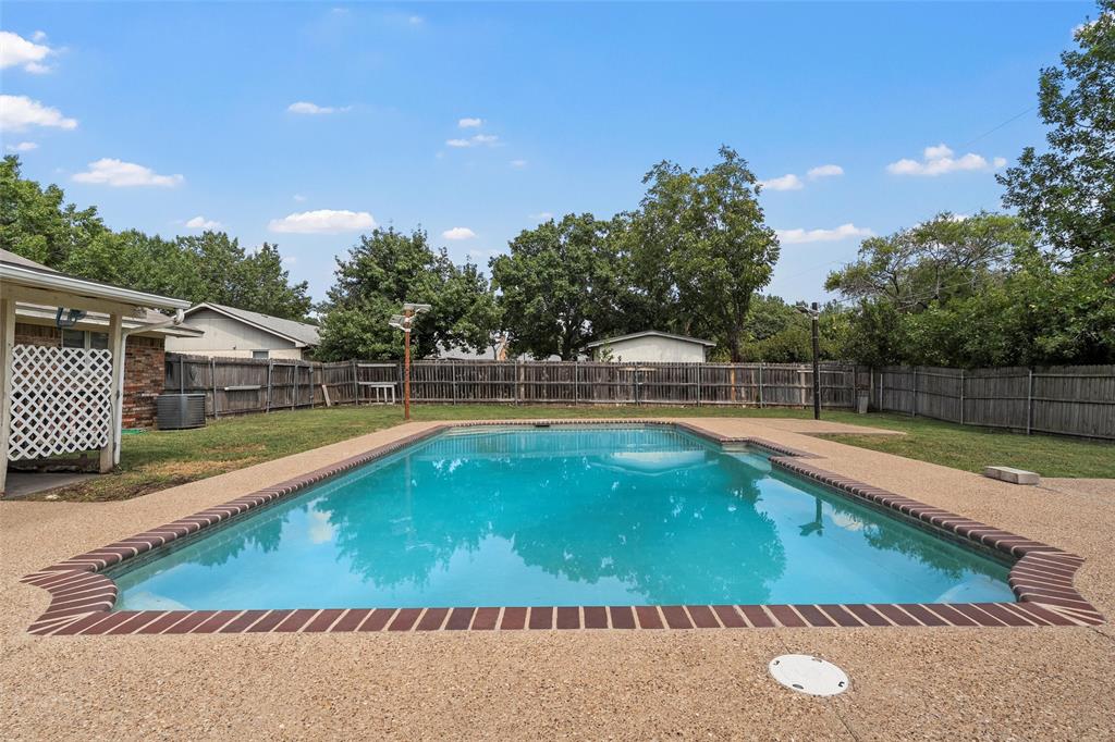 309 Crescent Drive Hewitt, TX 76643 - Photo 12 of 16 a view of a swimming pool and a yard