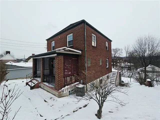 a front view of a house with yard