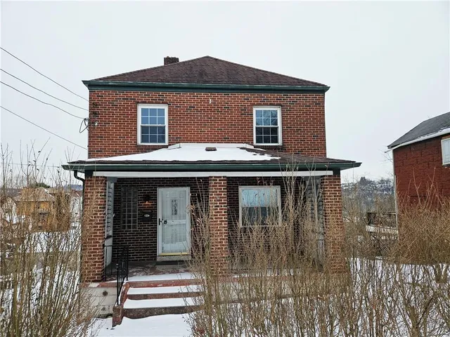 a front view of a house with a balcony