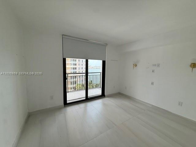540 Brickell Key Drive, Unit 1024 Miami, FL 33131 - Photo 16 of 28 an empty room with windows