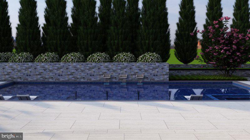 1011 Turkey Run Road McLean, VA 22101 - Photo 14 of 14 Stone walls and water features enhance the pool