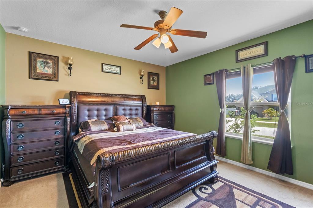 3509 Spring Creek Road Dundee, FL 33838 - Photo 16 of 32 a bedroom with a bed and a window