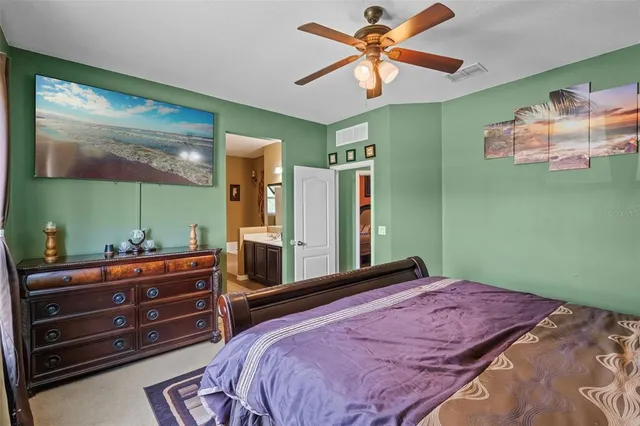 a bedroom with a bed and a dresser