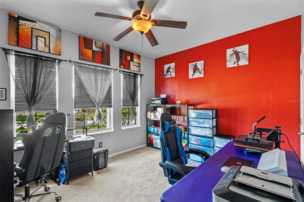 3509 Spring Creek Road Dundee, FL 33838 - Photo 21 of 32 a view of a workspace with furniture and a window