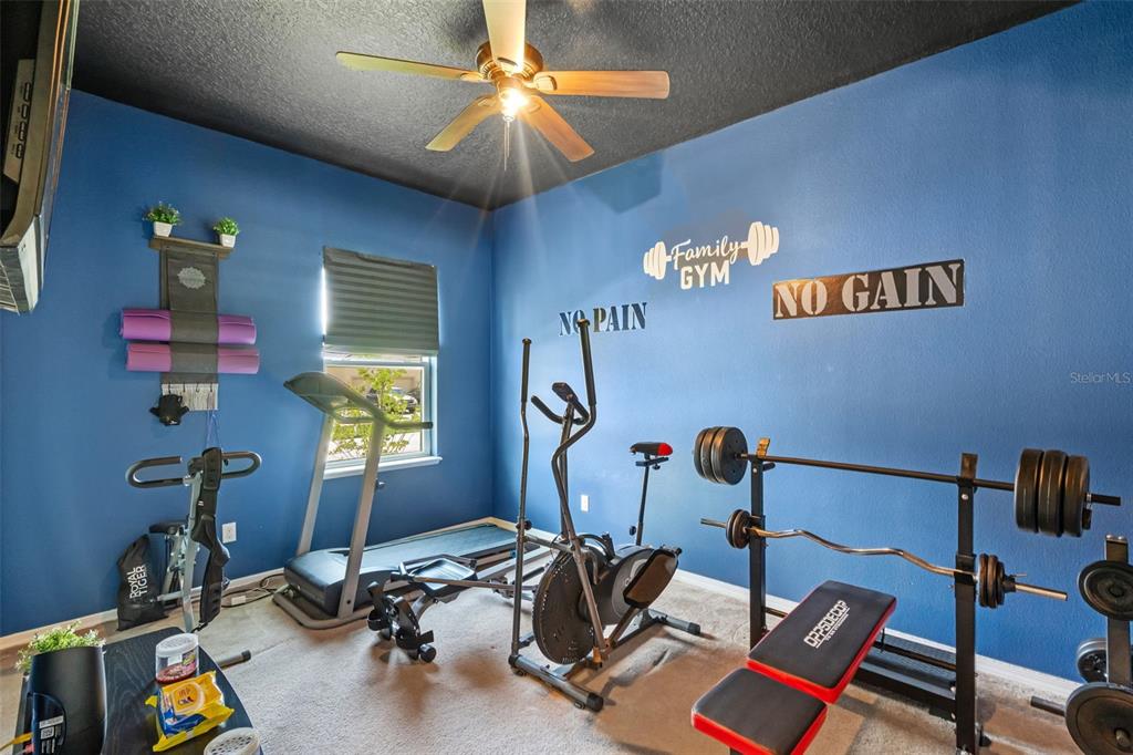 3509 Spring Creek Road Dundee, FL 33838 - Photo 22 of 32 a room with gym equipment