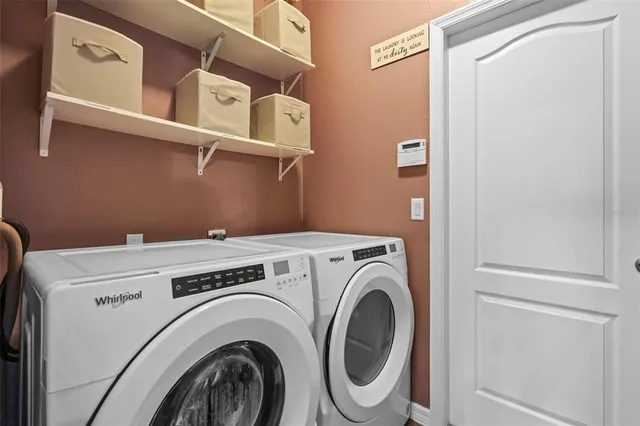 a utility room with dryer and washer