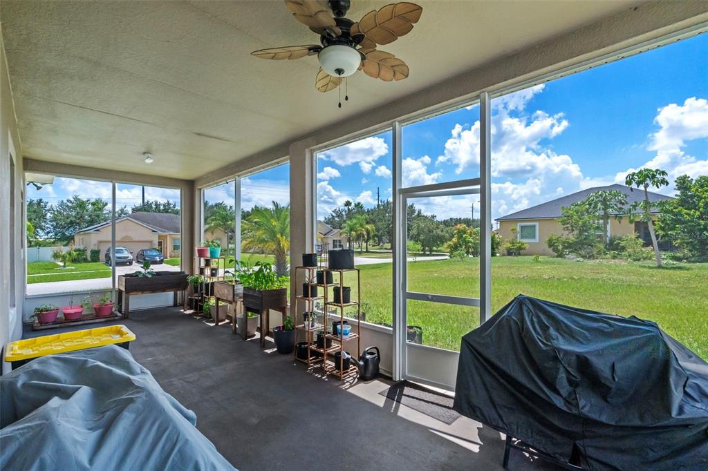 3509 Spring Creek Road Dundee, FL 33838 - Photo 26 of 32 a living room with furniture and a floor to ceiling window
