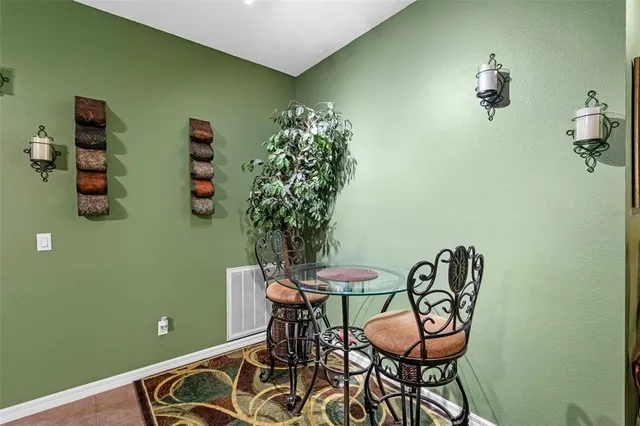 a view of a room with furniture and wooden floor