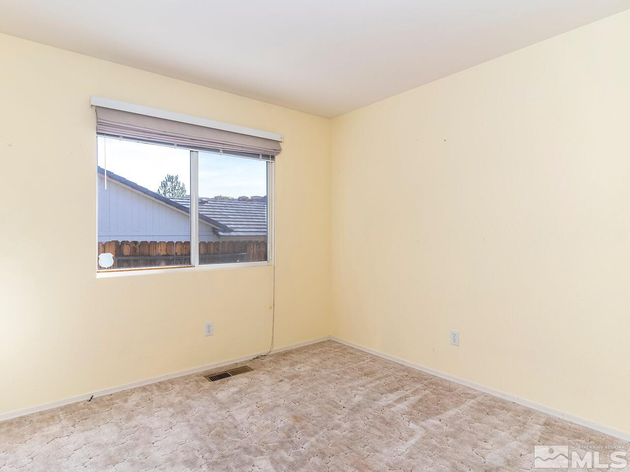 4765 Goodwin Road Sparks, NV 89436 - Photo 17 of 22 an empty room with a window