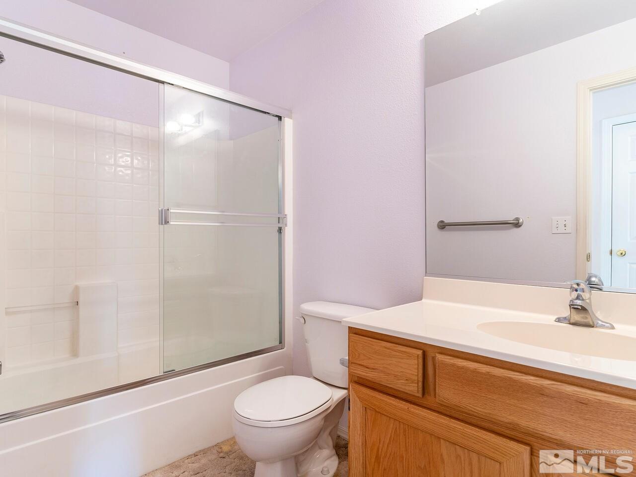 4765 Goodwin Road Sparks, NV 89436 - Photo 18 of 22 a bathroom with a sink toilet and shower