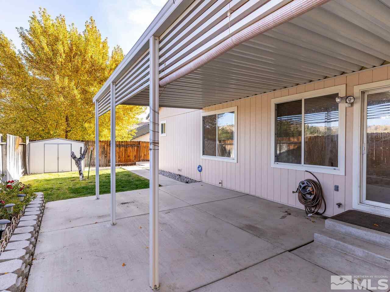 4765 Goodwin Road Sparks, NV 89436 - Photo 20 of 22 a view of a backyard with potted plants