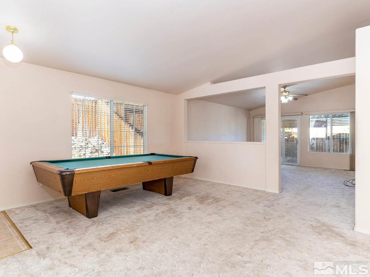 4765 Goodwin Road Sparks, NV 89436 - Photo 4 of 22 a room with pool table and windows