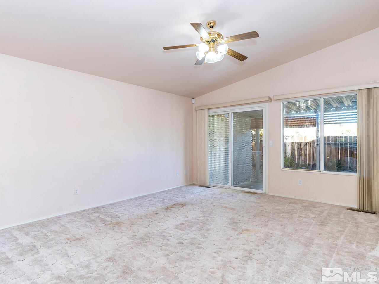 4765 Goodwin Road Sparks, NV 89436 - Photo 5 of 22 a view of an empty room with a window
