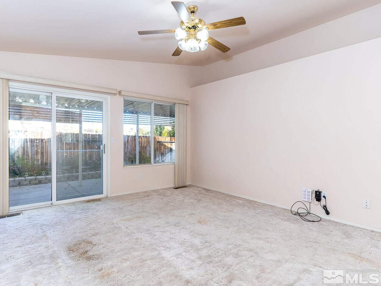 4765 Goodwin Road Sparks, NV 89436 - Photo 6 of 22 an empty room with a view of a livingroom