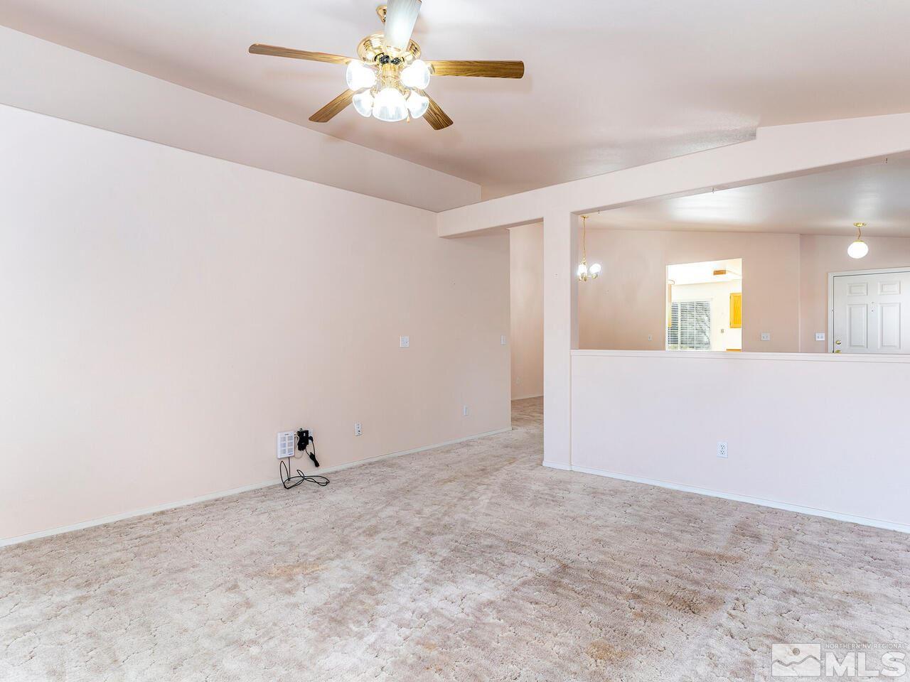 4765 Goodwin Road Sparks, NV 89436 - Photo 7 of 22 wooden floor in an empty room with a window